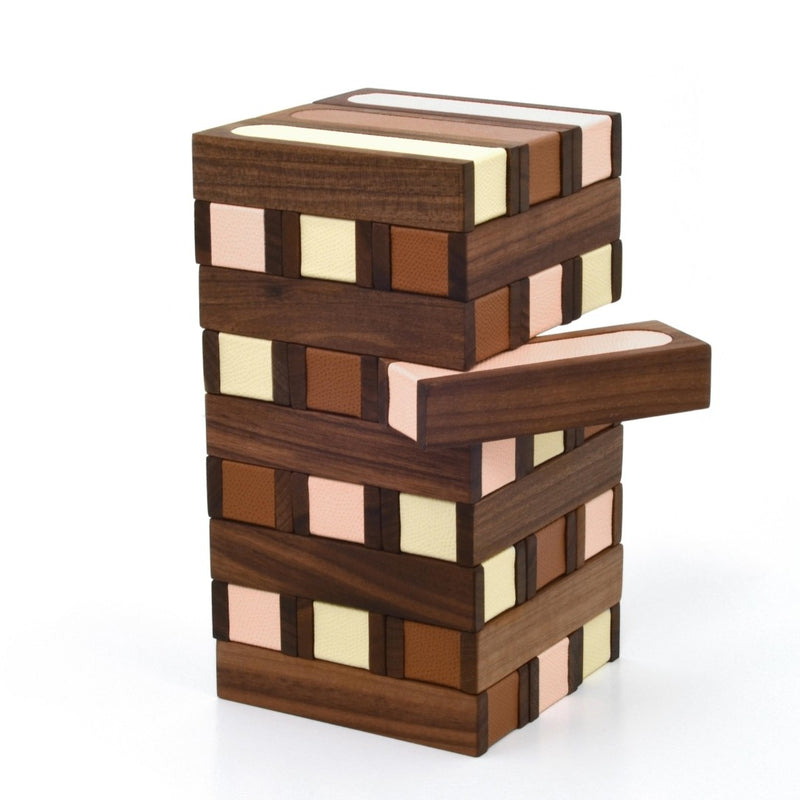 Wooden block tower puzzle with multicolored blocks on a white background