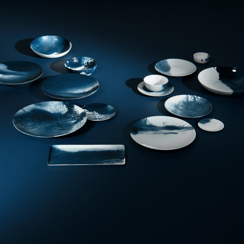 Luxury porcelain presentation plate Abysses collection Raynaud blue and white design on a dark blue background