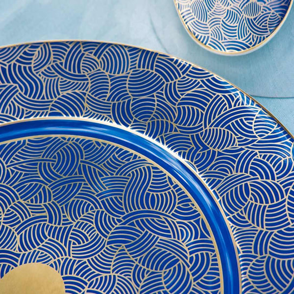 Imari presentation Blue porcelain plate with wave pattern on a light blue background