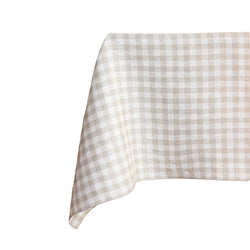 Checkered tablecloth with beige and white pattern on a white background