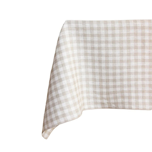 Checkered tablecloth with beige and white pattern on a white background