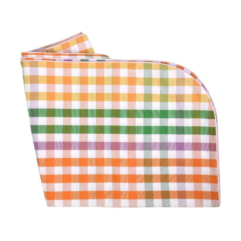 Folded checkered fabric with orange, green, and white pattern on a white background