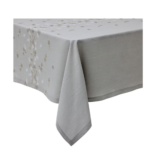 A silver grey linen tablecloth with embroidered floral pattern and a fringed edge.