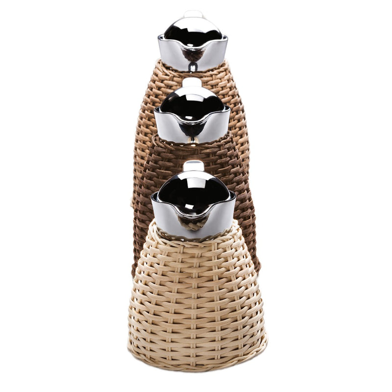 Luxury rattan insulated carafe Chantilly by Pigment France x Giobagnara in stainless steel and woven rattan – available in Natural, Light Brown, and Dark Brown.