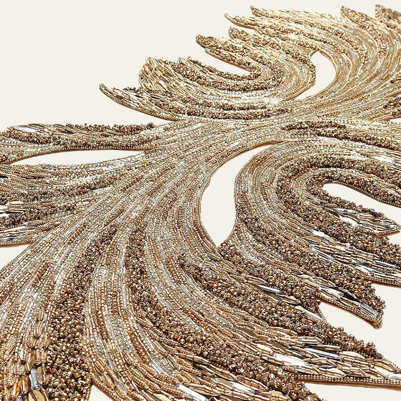 closeup up of a gold and crystal table runner on white background