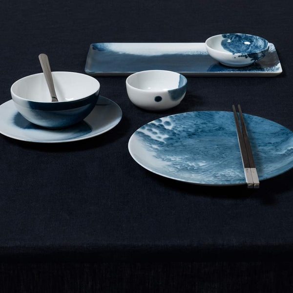 Set of Limoges porcelain rectangular serving tray Abysses collection by Raynaud on a dark surface