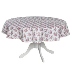 Round table with a floral tablecloth on a white background
