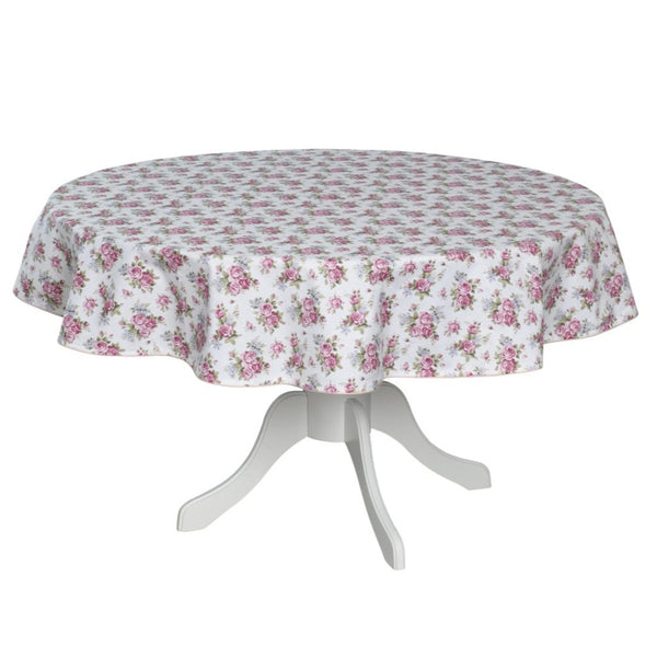 Round table with a floral tablecloth on a white background