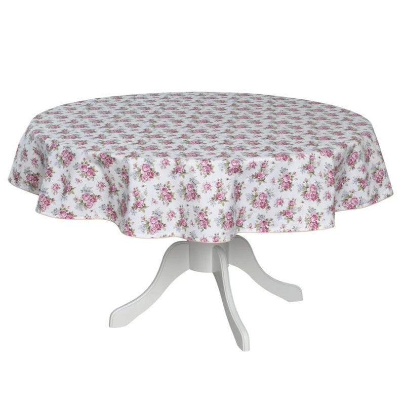 Round table with a floral tablecloth on a white background