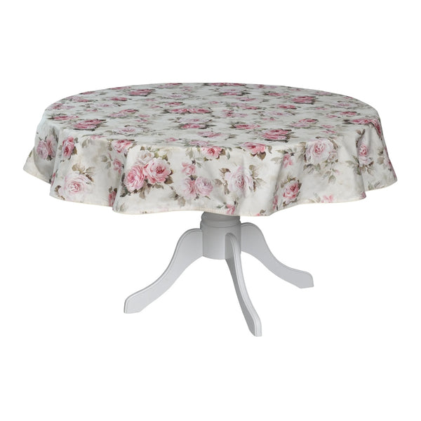 A round cotton tablecloth with a floral rose motif in beige, pink, and multicolor, displayed on a white table stand.
