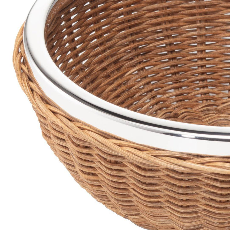 Close-up of round wicker bread basket with sterling silver rim by Sonja Quandt