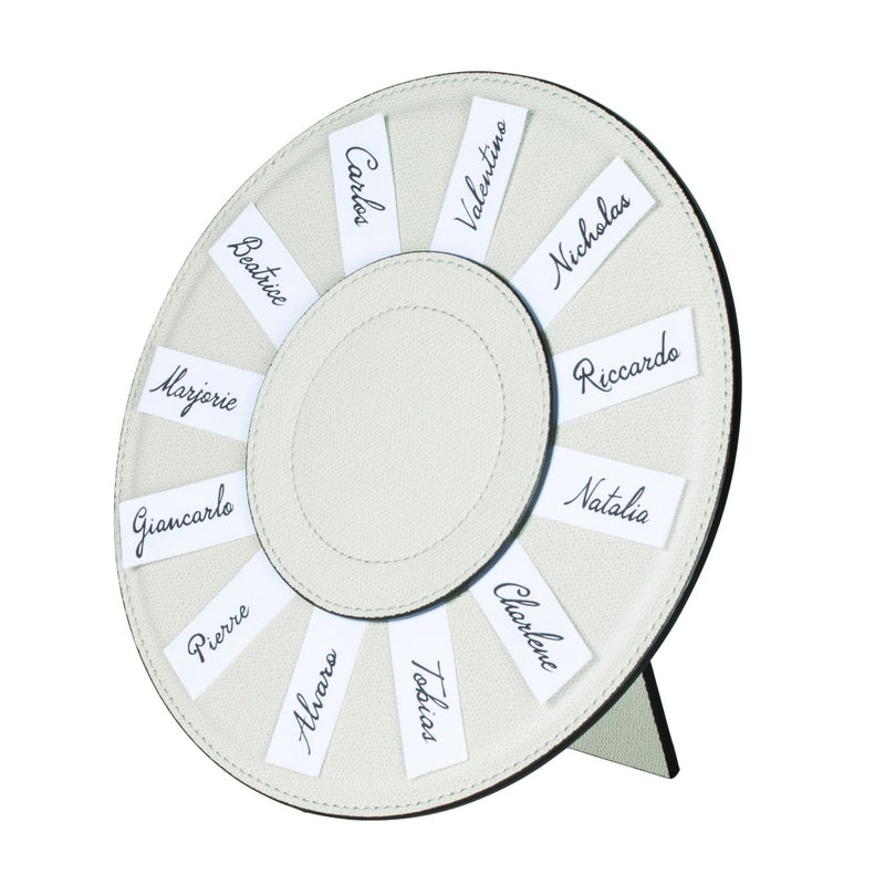 Styled Round Leather Seating Chart Name Holder Aspen by Giobagnara in beige leather with handwritten name cards.