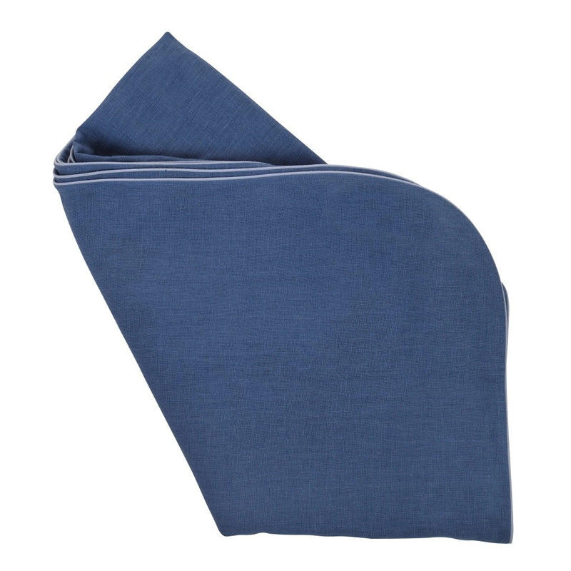 Folded blue fabric on a white background