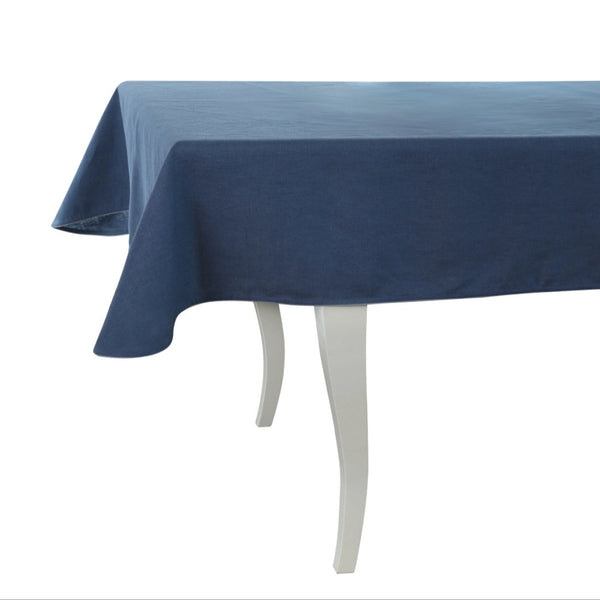 Blue tablecloth on a white table with a white background