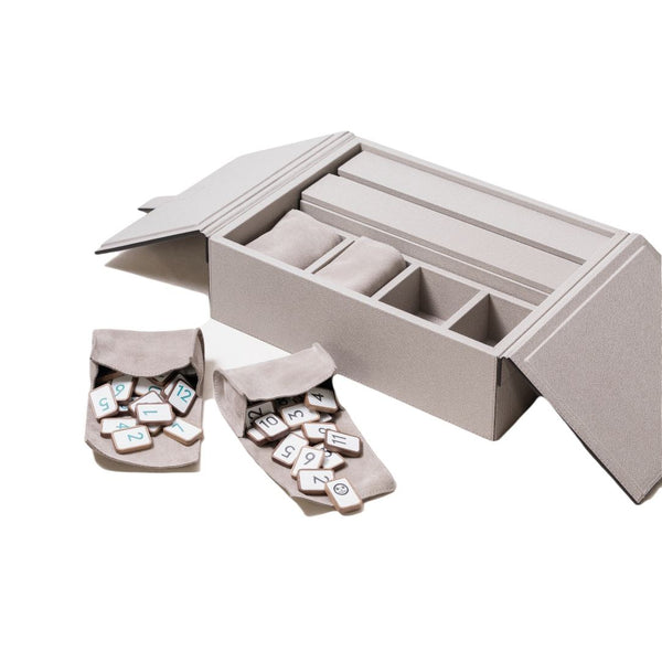 Open Rummikub Game Set in Taupe Leather by Giobagnara with luxury leather case and wooden tiles on a white background
