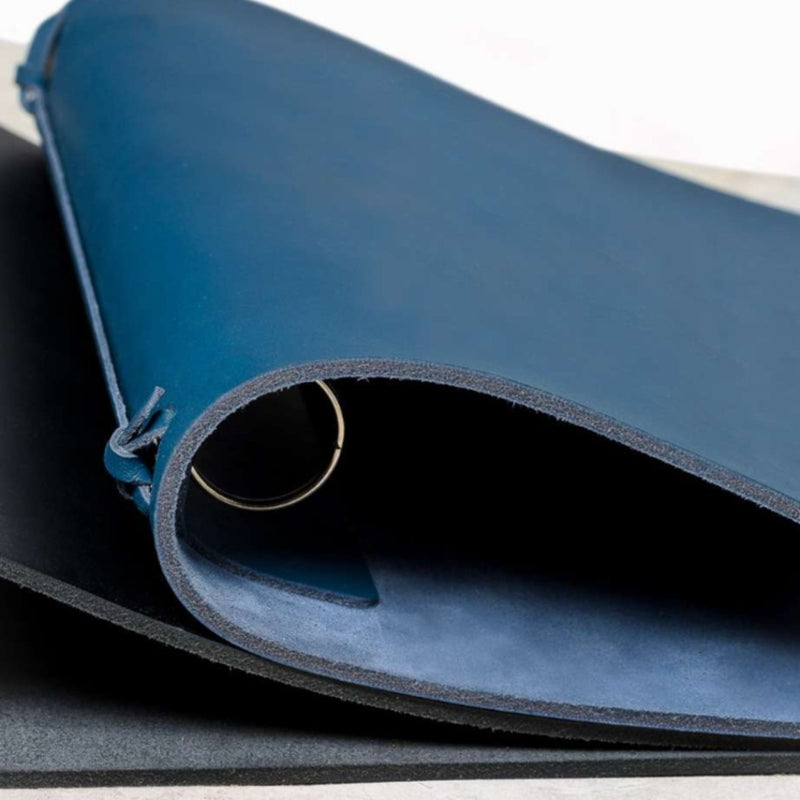 Close-up of Blue saddle leather ring binder Legacci by Giobagnara x Rabitti with central metal ring system