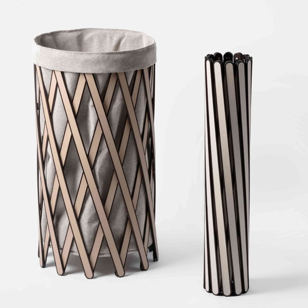 Woven basket with a gray liner and folded version on a white background