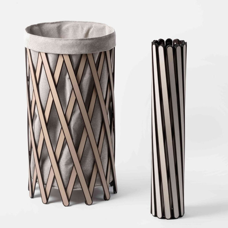 Woven basket with a gray liner and folded version on a white background