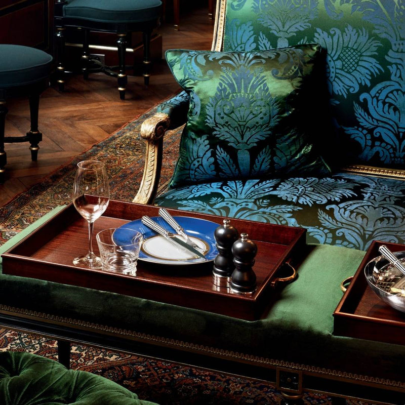 Styled cosy lounge featuring Salt and Pepper Mill Rencontre in wood with silver-plated top and base by Ercuis, elegant French design for refined dining.