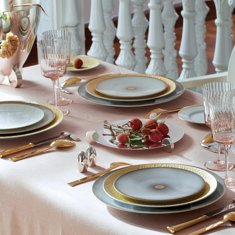 Elegant table setting with plates, glasses, and Salt and Pepper Shakers Set Galet Silver-Plated by Ercuis on a pink tablecloth.