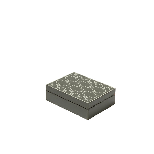 A small rectangular grey humidor with a geometric pattern on the lid, made of leather, cedar, and walnut.