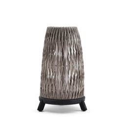 Woven outdoor lamp with black base on a white background