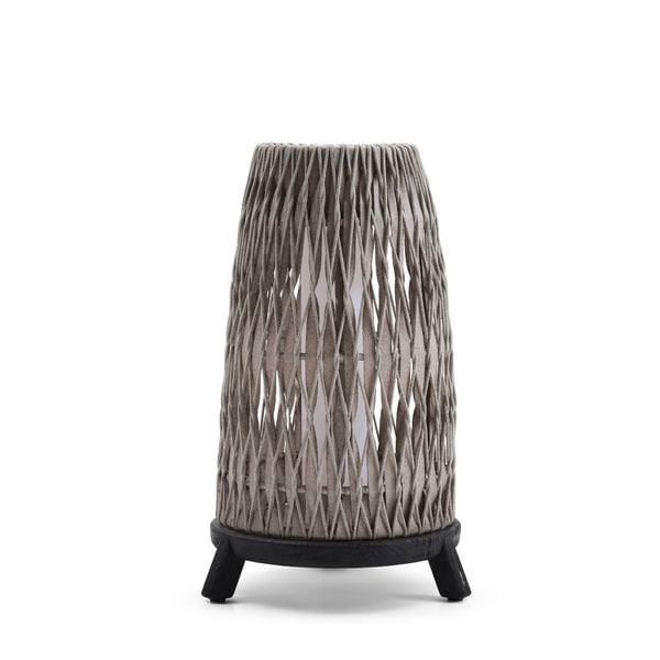 Woven outdoor lamp with black base on a white background