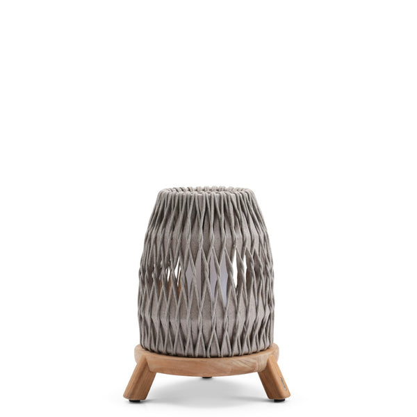 Decorative lantern with woven top and wooden base on a white background