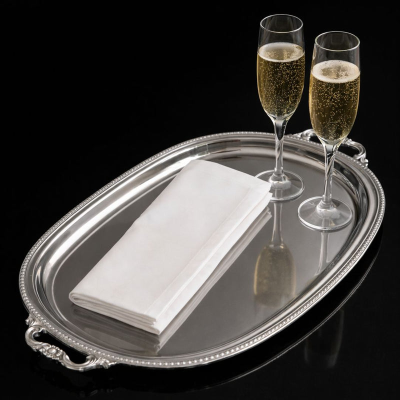 Camillatex white cotton service cloth on a silver tray with champagne glasses