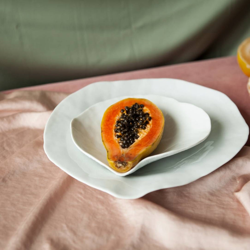 Styled papaya featuring Sculptural porcelain small plates White No5 Indulge Sarah-Linda