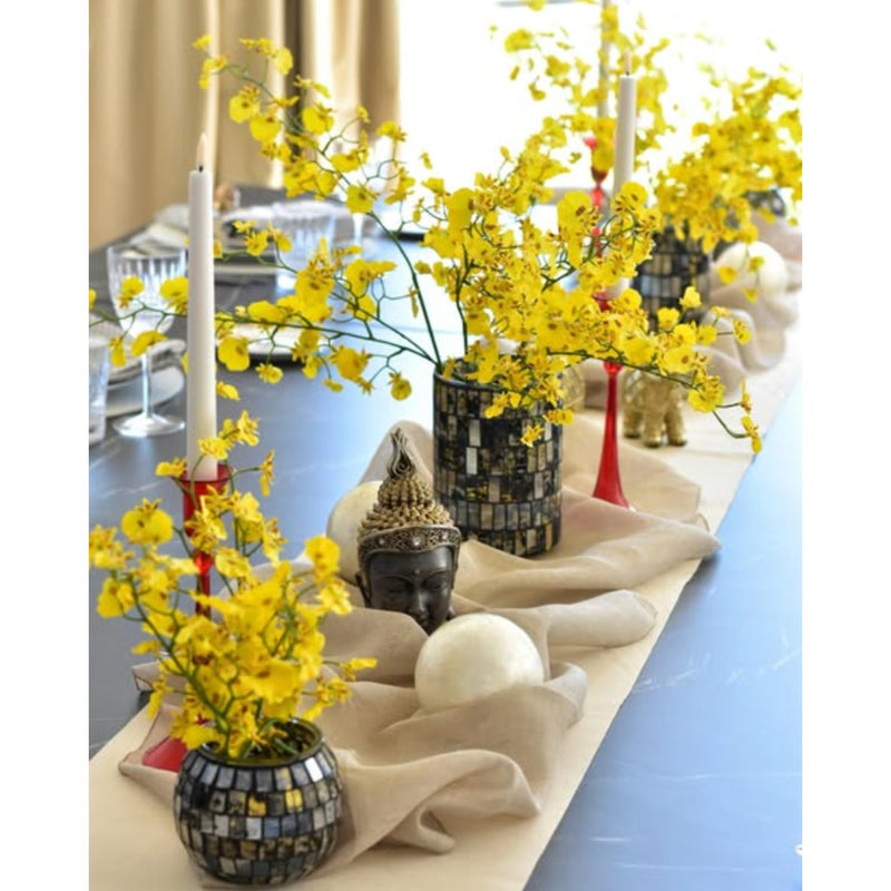 Styled table with Handcrafted artificial yellow orchid spray made from waxed silk by Silk-ka, part of the Flowers For Life collection by Amiramour.
