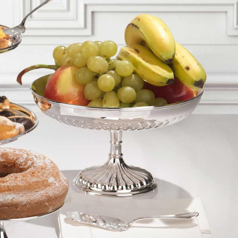 Silver-plated English fruit stand by Greggio on table with fruits and pastries.