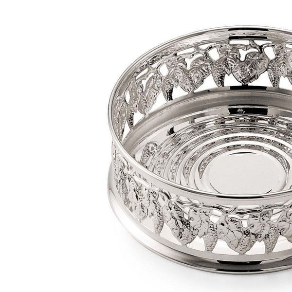close-up Silver plated pierced wine bottle coaster with grape motifs by Greggio, ornate classic wine accessory
