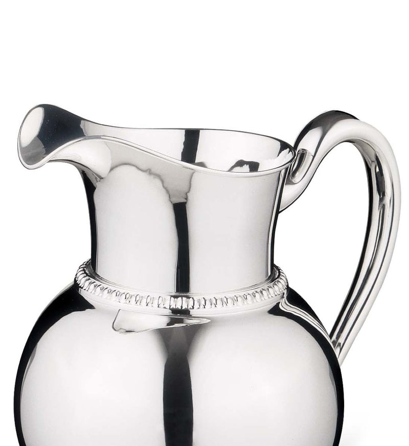 Close-up of Luxury 2.3 L silver-plated pitcher Queen Anne by Greggio with beaded neck and curved handle 