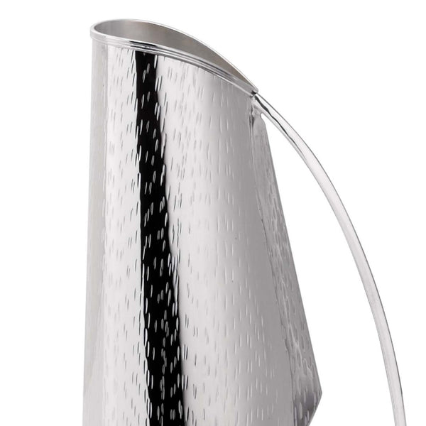 Close-up of silver-plated pitcher Rain by Greggio with sculptural shape and textured finish – handcrafted Italian design for elegant dining and yachts.