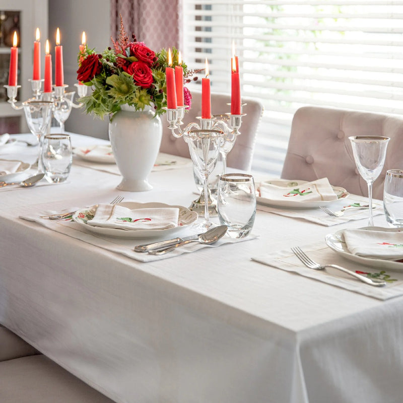 Silverline white cotton tablecloth with fine silver trim by Roseberry Home styled on a festive table