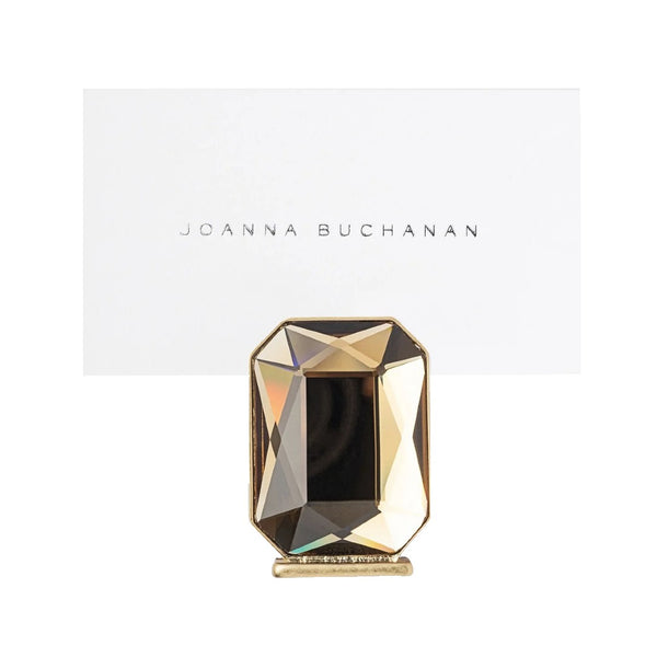 Decorative place card holdert with geometric design on a white background, featuring the brand 'Joanna Buchanan'.
