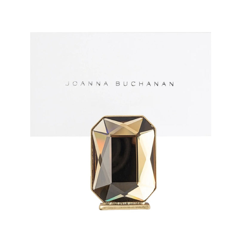 Decorative place card holdert with geometric design on a white background, featuring the brand 'Joanna Buchanan'.