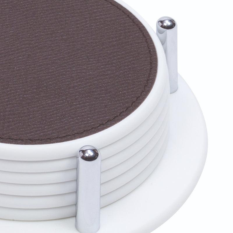 Set of white corian with brown leather pads on a white background
