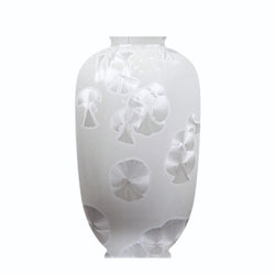 A white porcelain vase with a floral pattern and a matte finish.