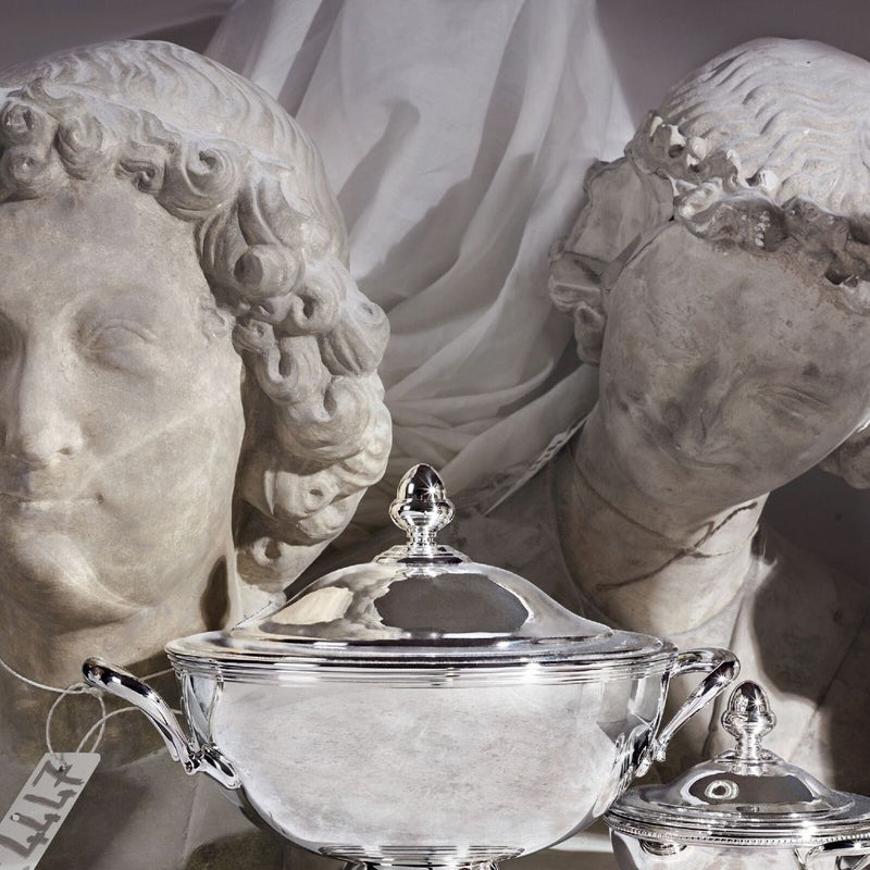 Silver covered soup toureen by Ercuis dish with classical busts in the background