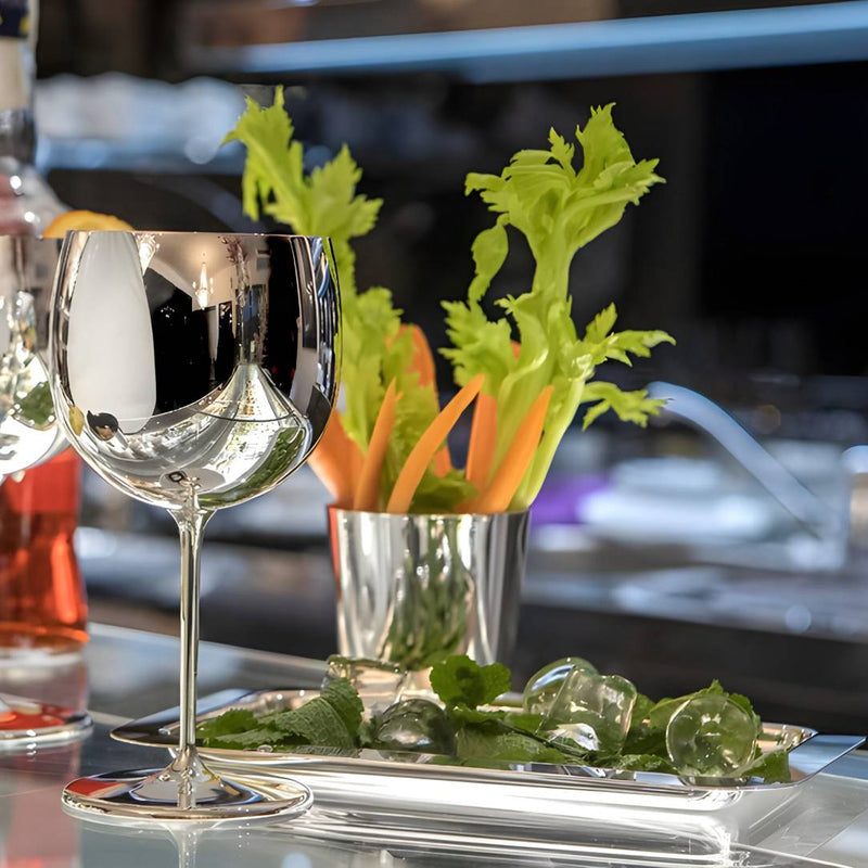 Elegant Italian silver-plated spritz glass from Greggio Manhattan Collection and garnishes on a bar counter