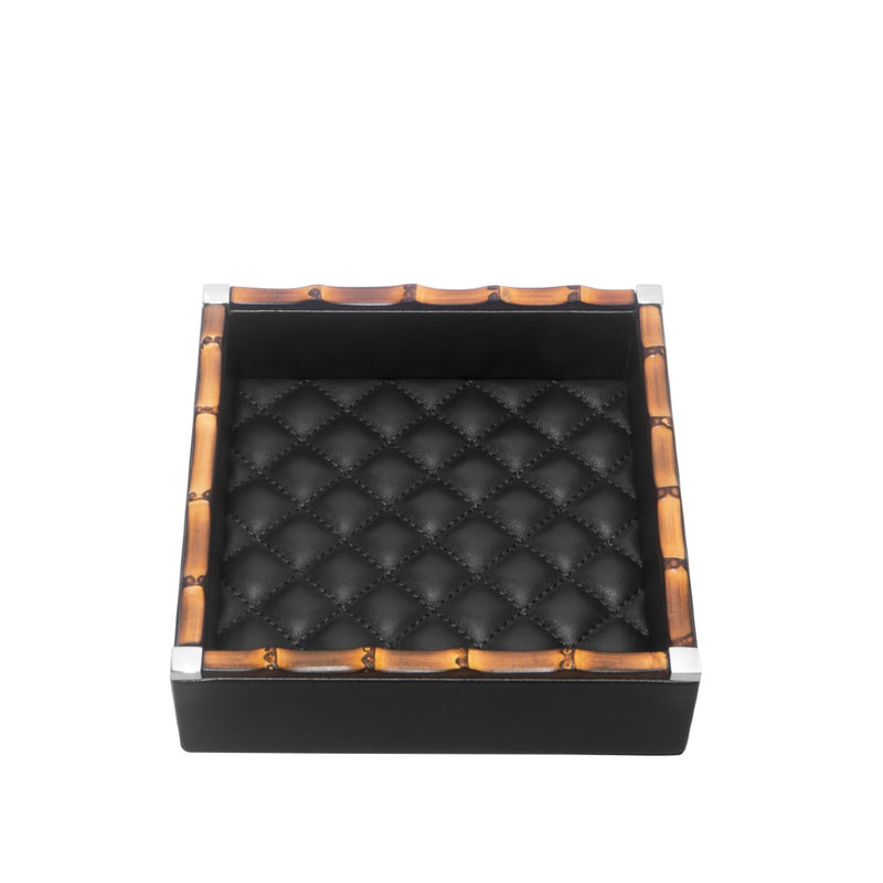 Black quilted leather box with brown accents on a white background