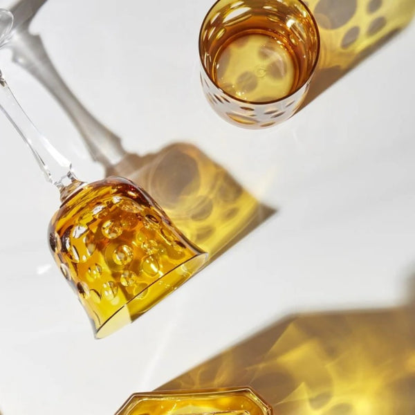 Styled Amber crystal old fashion tumbler with bubble cut design from the Staccato collection by Cristallerie de Montbronn.