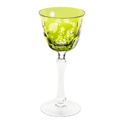 A green crystal white wine glass with a clear stem and multiple bubbles design
