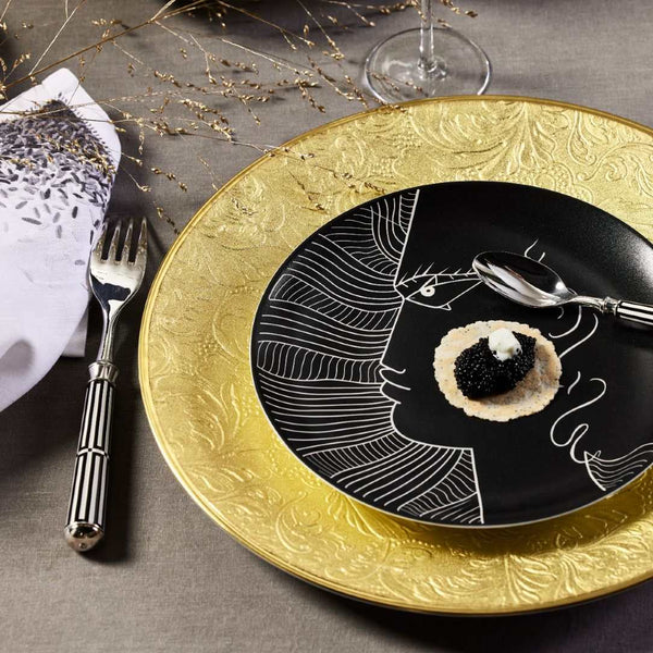 Styled table with gold and Limoges porcelain plate black with Le Gabier de Vigie motif Jean Cocteau Raynaud