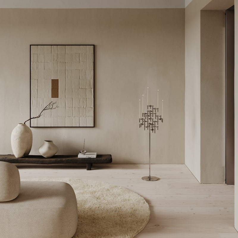 styled living room with the floor stand in chrome by stoff nagel