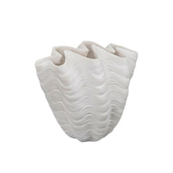 White ceramic vase with wavy texture on a white background