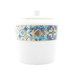 White sugar bowl with a decorative blue and gold band on a white background