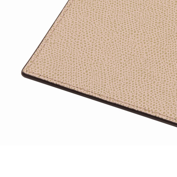Close-up of Tao double-faced square leather coaster in cappuccino by Giobagnara, reversible Italian table decor